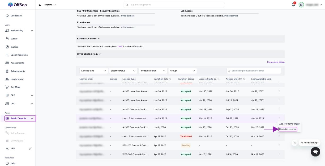 The Licenses page in the Admin Console. The My Learners table has the row menu open on a Learn Enterprise license, with the Reassign License option highlighted by an arrow.